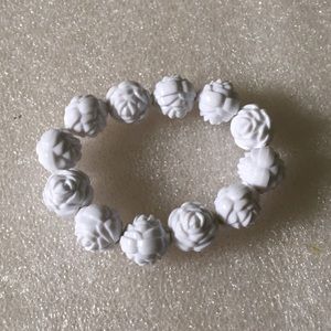 Engraved flower lucite bracelet